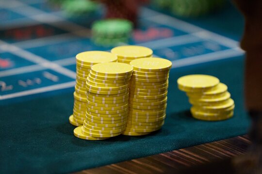 Stacked Poker Chips on Casino Table with Selective Focus
