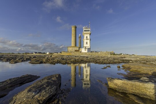 Lighthouses, Vieille tour, the chapel Saint-Pierre of the Phare de Penmarc'h the Phare d'Eckm&uuml;hl are reflected in the sea, Penmarc'h, D&eacute;partement Finist&egrave;re, France