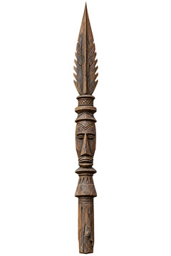 Wooden spear head with carved tribal face totem design crafted from brown aged rustic material on transparent background