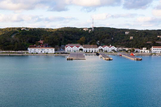 Mahon harbor waterfront with boats and town