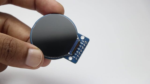 Round display module for electronics prototyping projects held in hand