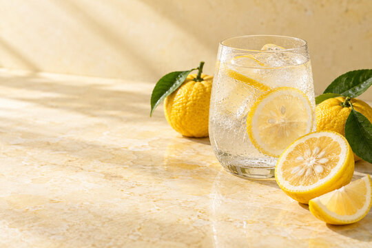 Yuzu citrus sparkling water with fresh fruit and copy space