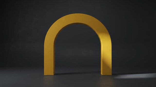 A simple metallic golden arch stands against a dark minimalist background, illuminated by directional light that creates a long dramatic shadow.