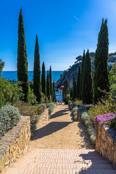 Beautiful view of Templet Linne in Marimurtra botanic garden near Sa Forcanera bay at Brava coast with Mediterranean Balearic sea in background on summer sunny day, Selva, Girona Catalonia, Spain