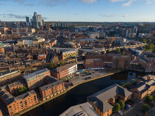 Fototapeta premium Aerial Image of River Aire Waterfront, The Calls, and Leeds Skyline at Sunrise