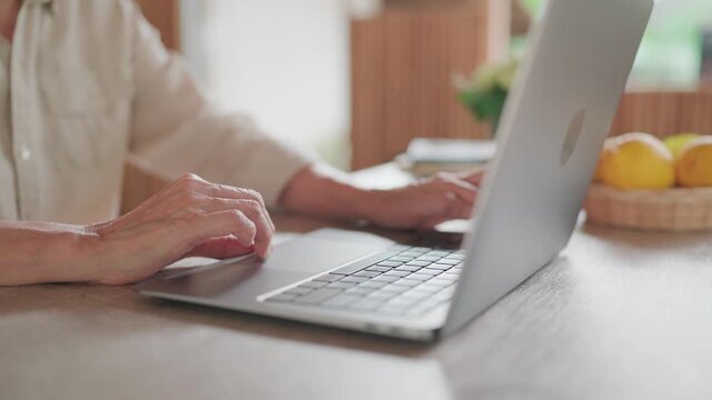 Woman, home typing laptop computer in kitchen with technology social media, online ebook networking. female, remote work and internet or research for entertainment, communication freelance blog post