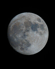 A detailed view of a full moon against a black background. © Daan Klein