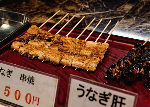 Grilled unagi eel skewers Japanese food Local market Traditional street food Japan travel 