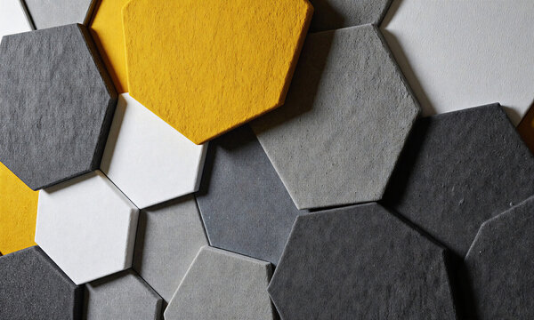 Acoustic hexagonal felt tiles create a modern geometric wall pattern for office soundproofing and interior decoration