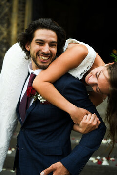 Joyful wedding couple playful moment