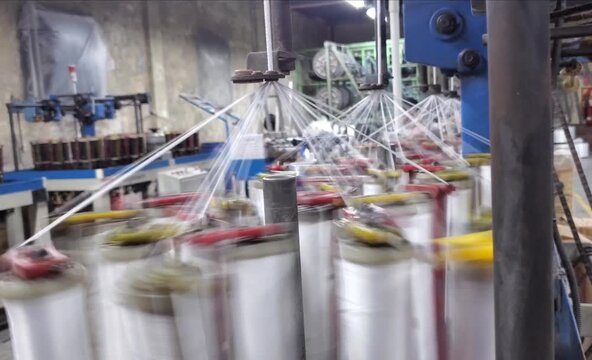 High Speed Textile Braiding Machine Making Drawcord Lace In Garments Factory Bangladesh
Close up of industrial braiding machine working in textile factory. 