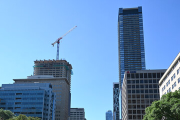 Obraz premium Toronto, Ontario, Canada - June 28, 2026: Construction crane and skyscrapers in Toronto.