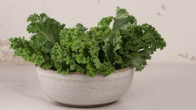 fresh kale leaves in bowl clean eating concept zoom