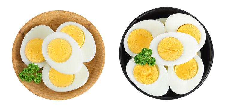 Boiled chicken egg in wooden and ceramic bowl isolated on white background. Top view. Flat lay