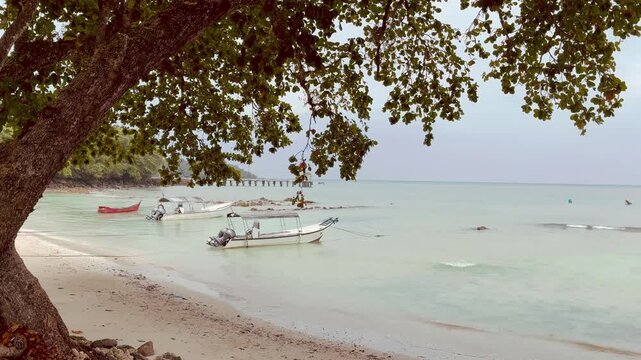 Paradise beach with boats at Pulau Weh island Aceh Sumatra Indonesia
