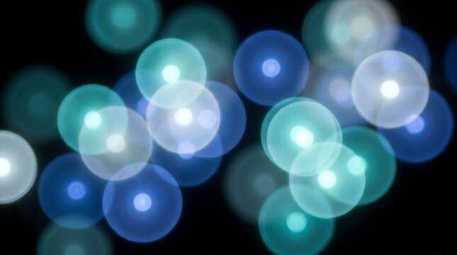 Glowing bokeh light orbs in teal blue and white floating on black background, soft defocused circles abstract