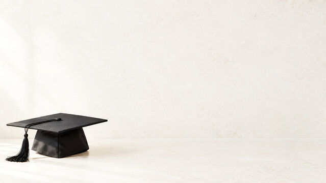 Graduation cap on white desk, university achievement and education banner with copy space