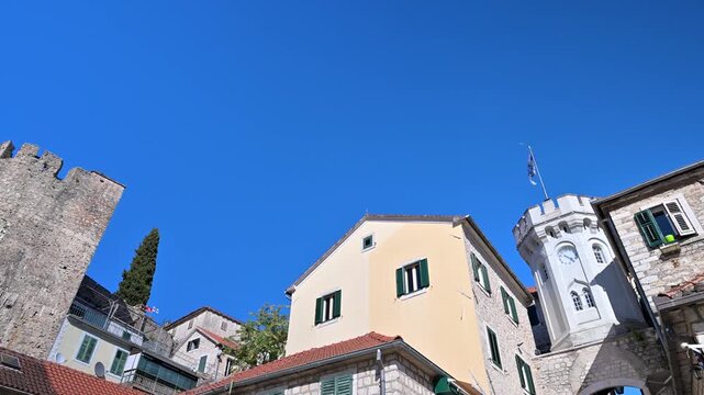 Herceg Novi Clock Tower against a clear blue sky