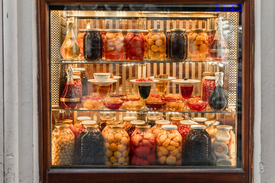 Turkey, Istanbul 03 10 2025: Storefront display of historic Haci Abdullah restaurant near Istiklal Street featuring colorful jars of pickled vegetables, fruits, and olives.