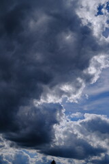 Obraz premium Dramatic Storm Clouds with Bright Edges and Blue Sky