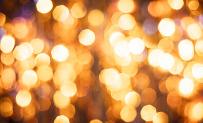 Fototapeta premium Abstract background with dense golden bokeh lights, decorative backdrop.
