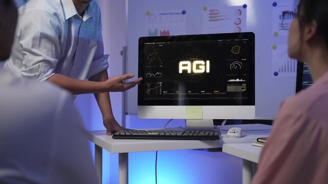 Professional presenting AGI artificial general intelligence data on computer screen in office