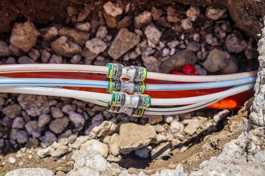Optical fibre cables connected by joints installed in a ground. These are used to deliver high speed internet