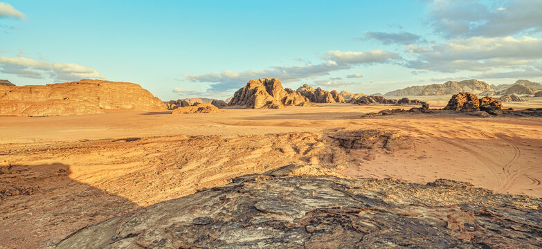 Wadi Rum desert landscape lit by moody afternoon sunset light - location similar to planet surface, used in many science fiction movies