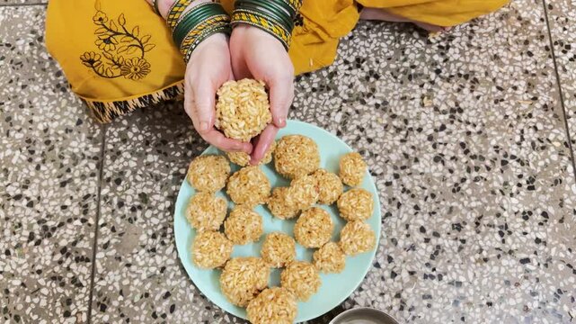 Traditional Indian Puffed Rice Ladoo Preparation During Religious Festival Celebration