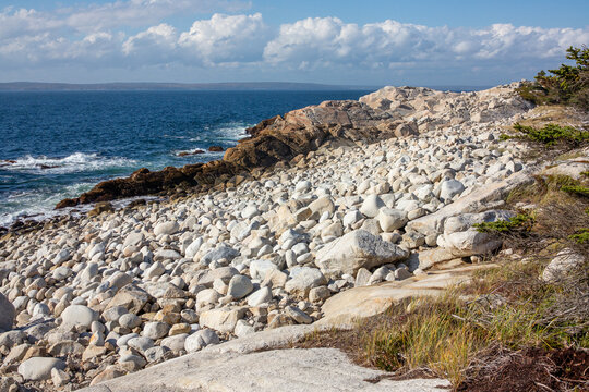 rugged granite and pebble coastal landscape that appears to be consistent with the shores of Herring Cove Provincial Park Reserve in Nova Scotia, Canada