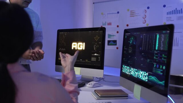 Engineers working on artificial general intelligence system in office