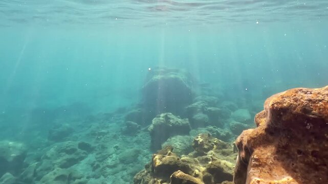 Snorkeling at Rhodes near Faliraki, not much marine life, only sun rays shining to rocks visible in clear water
