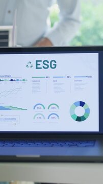 Vertical Screen : Closeup group Asia businesspeople talk ESG strategies risk management workshop, SDGs report, global warming, green finance and investment and net zero waste in boardroom building.