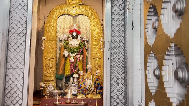 Lord Venkateshwara Deity with Intricate Ornaments Flowers and Sacred Temple Offerings