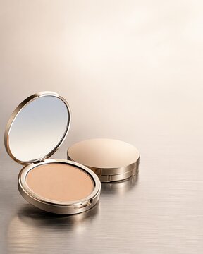 Open golden compact powder case mockup with mirror on metal surface for makeup product launch