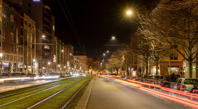 Breiter Weg (Broadway) in Magdeburg, Germany, in the evening during the christmas season, blurred traffic with light traces of cars