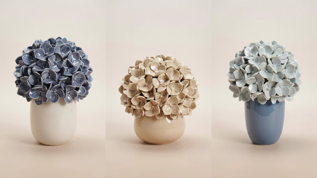 Three ceramic vases with spherical hydrangea flower bouquets on a light beige studio background