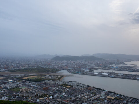 View of Takamatsu city and Seto Inland Sea at dusk from Shishi no Reigan observatory on Yashima - Kagawa prefecture, Japan
