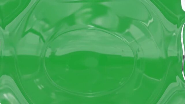 A small transparent liquid ring appears in the center and begins orbiting around an invisible horizontal axis