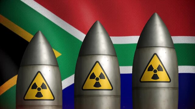 Three nuclear missiles rising against the South African national flag