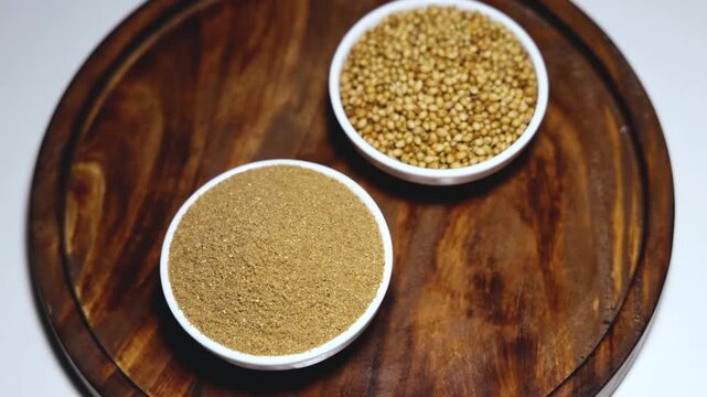 Indian spice called coriander powder and coriander seeds 