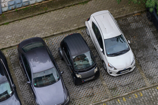 Overhead View of Smart Car and Sedans in Parking Lot