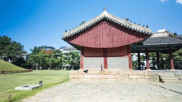  4k Timelapse of Jeongja-gak shrine and royal mound at Jeongneung Royal Tomb under clear blue sky in Seoul