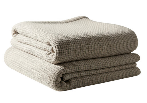 Stack of folded soft beige knitted wool blankets isolated on transparent background