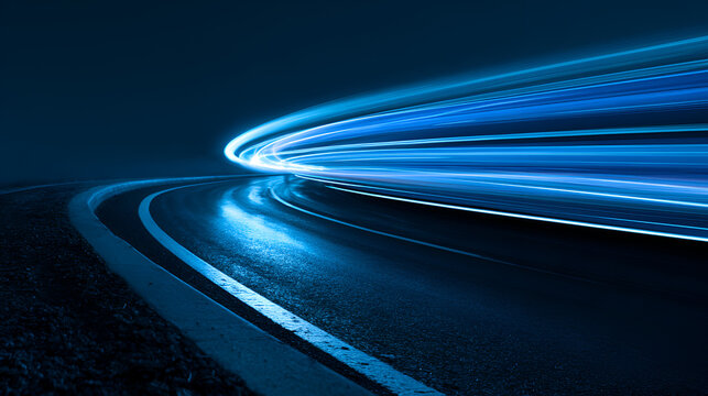 Long exposure photograph of vibrant blue and purple light trails on a highway at night.