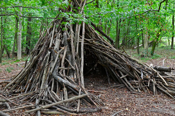 Treehouse or tent—a teepee made of sticks that children built in the woods © Christian Bunge