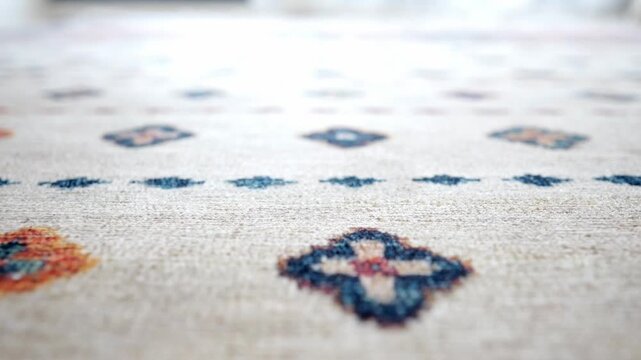 Soft neutral carpet texture with geometric pattern moving in slow motion