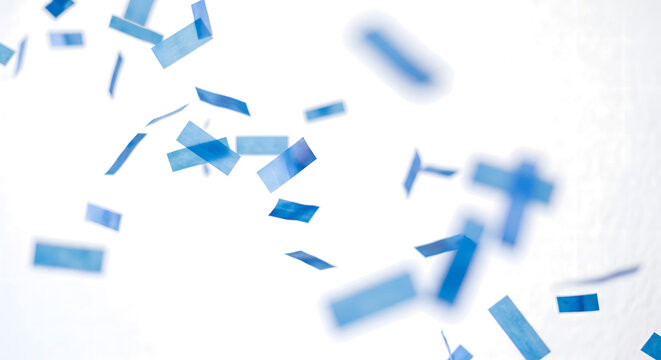 Blue confetti pieces falling down isolated on transparent background