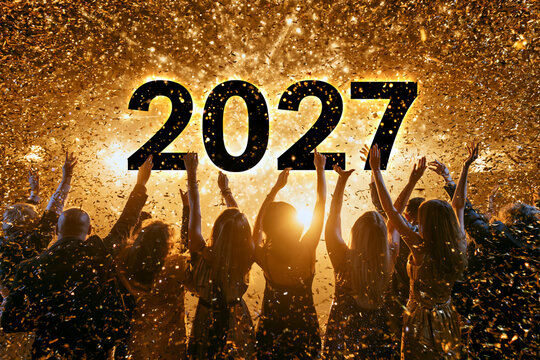 Golden confetti rains down as people raise their hands. Silhouettes glow against a bright, celebratory backdrop. They cheer, joyous, as 2027 shines boldly above. Perfect for New Year's