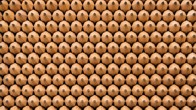 Repeating geometric pattern of hexagonal gold metallic embossed texture with subtle depth
